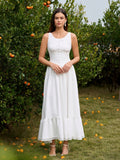 Woman wearing a white embellished button maxi dress with lace trim
