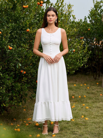 Woman wearing a white embellished button maxi dress with lace trim