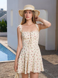 Woman in a straw hat wearing a floral print mini dress