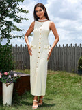 Full body shot of a woman in a beige ribbed knit dress