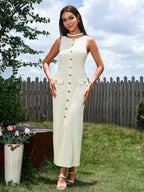 Full body shot of a woman in a beige ribbed knit dress