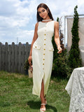 Woman wearing a beige sleeveless button midi dress with a split hem