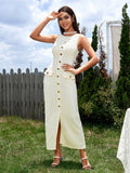 Model posing in a beige sleeveless button front dress outdoors