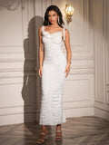 Close-up of the embellished neckline on a white ruched maxi dress