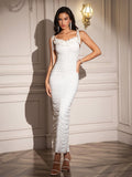 Woman wearing a white ruched maxi dress with embellished knot straps from the front