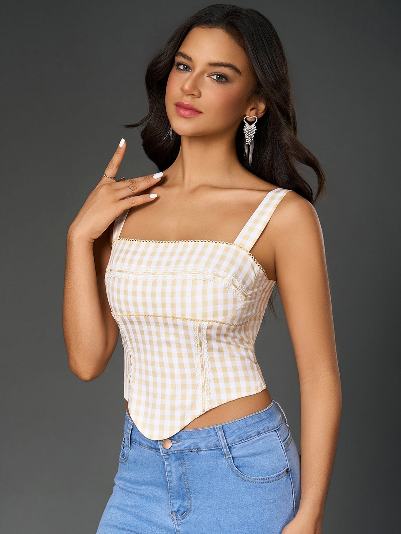 Model showcasing the fit and silhouette of an asymmetrical hem crop top