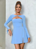 Full length shot of a woman posing in a blue cut out dress