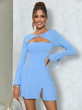Woman wearing a blue long sleeve cut out mini dress with a twist front detail