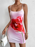 woman wearing a pink bodycon dress with a large red poppy print