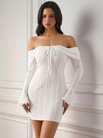Woman wearing a white off-the-shoulder lace sheath dress with tie front and bell sleeves