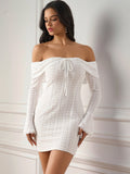 Front view of a woman in a white lace off-the-shoulder dress with long bell sleeves