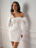 Model posing in a white off-the-shoulder lace sheath dress with tie front and bell sleeves