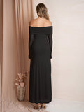 Back view of a woman in a black off-the-shoulder maxi dress.