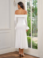 Back view of a woman in a white off-the-shoulder midi dress with ruched bodice and flared sleeves.