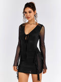 Side profile of a woman wearing a black sheer mesh party dress