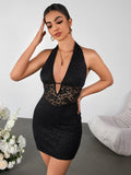 Woman posing in a black lace halter dress