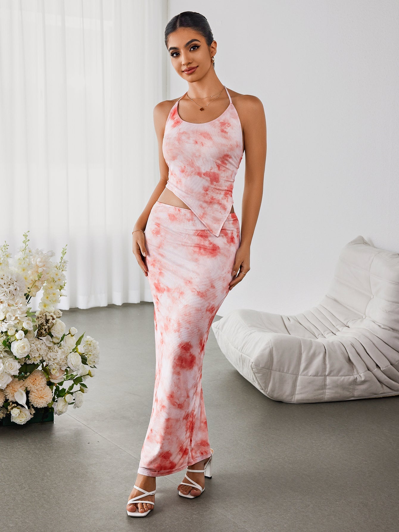 Full front view of a woman in a tie-dye maxi dress