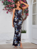 Woman posing in a floral print satin maxi dress with a sweetheart neckline and high slit