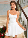 Woman wearing a white satin dress with lace overlay and a pleated skirt, standing on stairs.