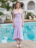 Woman wearing a lavender lace mermaid dress with spaghetti straps and a V-neck.