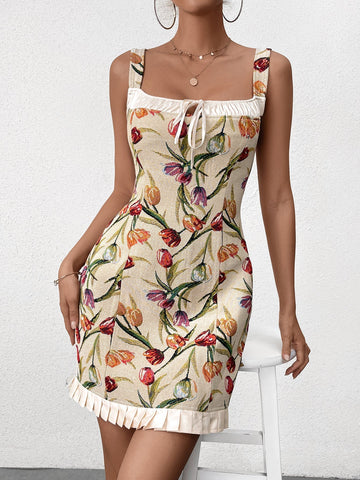 Woman wearing a sleeveless floral print bodycon dress with a square neckline and ruffled hem