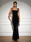 Elegant black velvet maxi dress with glitter details