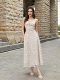 Front view of a woman modeling a cream floral print midi dress with adjustable straps