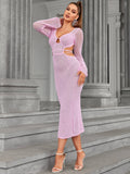 Woman with hand on neck wearing a pink knit midi dress with cut-out details.