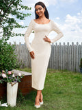 Woman standing in a cream ribbed knit long sleeve midi bodycon dress with a scoop neckline, showing the dress's fit.