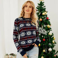 Close-up of a woman wearing a red and white festive knit sweater with a holiday print.