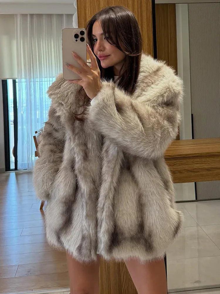 Close-up of the textured faux fur on a woman's jacket.