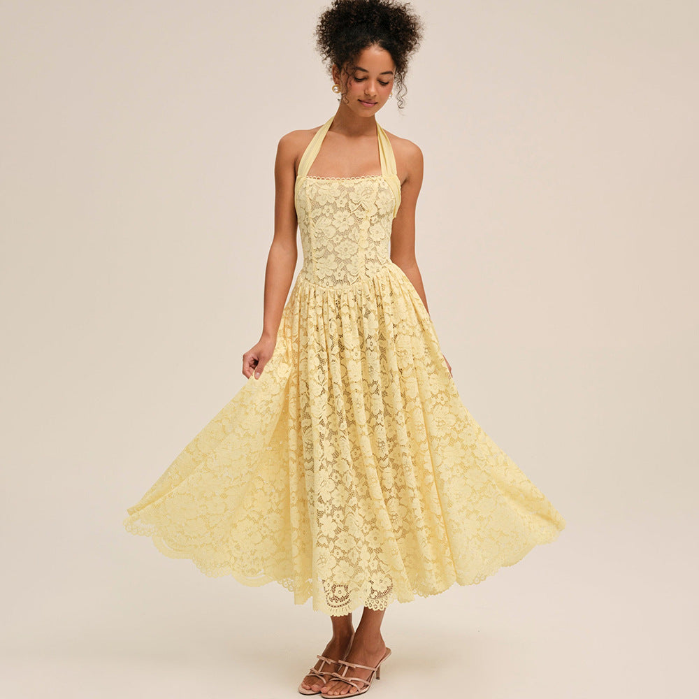 Woman wearing a yellow lace dress on a beige background