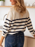 Back view of a woman in a striped knit sweater.
