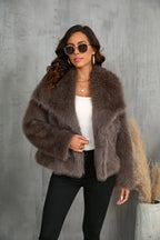 Close-up of a woman wearing a brown faux fur cropped jacket