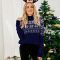 Woman smiling while wearing a red Fair Isle turtleneck sweater