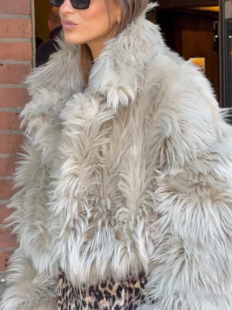 Close-up of the textured faux fur on a light grey jacket