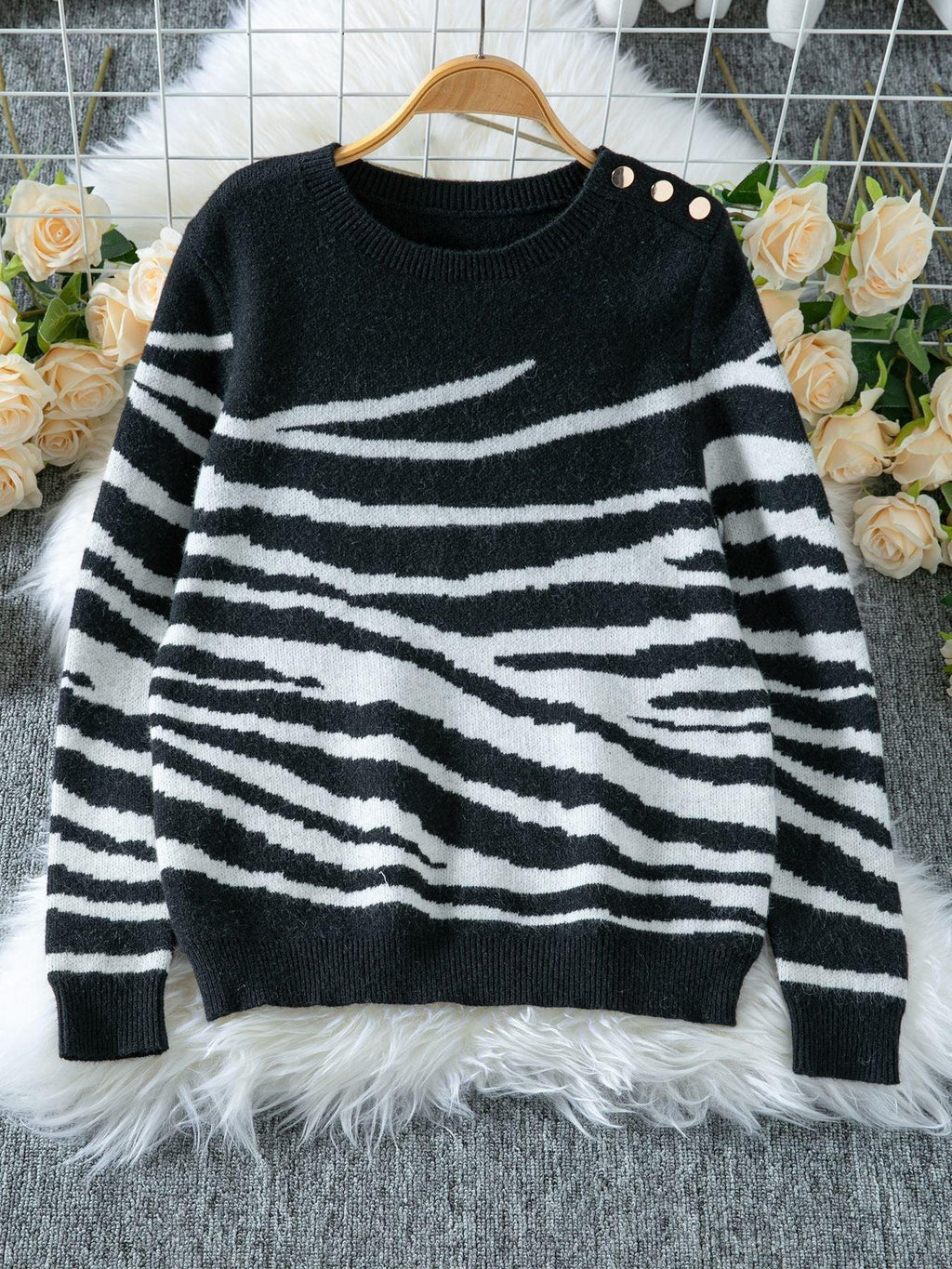 Woman wearing a white and brown zebra print crew neck sweater - View 9 | WEUXS
