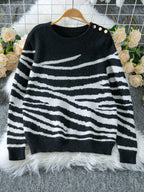 Woman wearing a white and brown zebra print crew neck sweater - View 9 | WEUXS