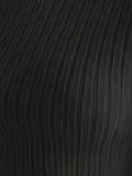 Close-up of the black ribbed knit fabric of the top, showing vertical ribbing detail.
