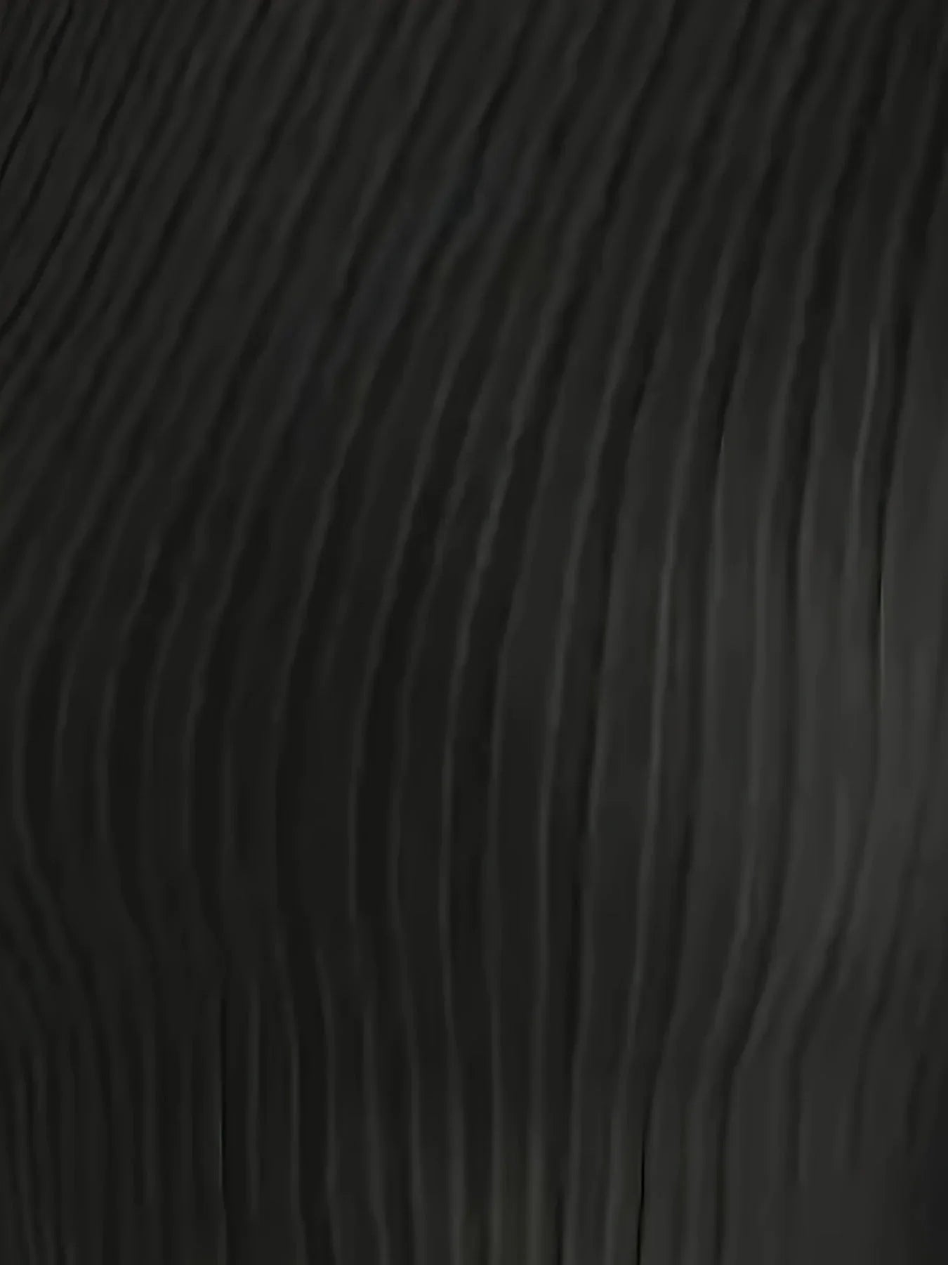 Close-up of the black ribbed knit fabric of the top, showing vertical ribbing detail.
