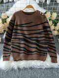 Woman wearing a white and brown zebra print crew neck sweater - View 10 | WEUXS
