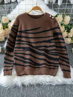 Woman wearing a white and brown zebra print crew neck sweater - View 10 | WEUXS