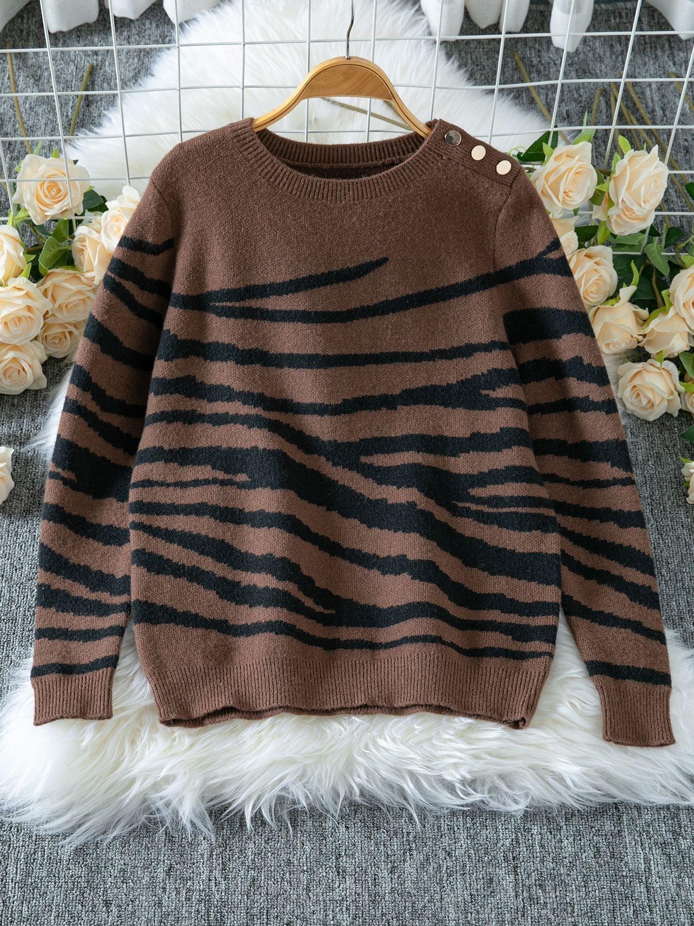 Woman wearing a white and brown zebra print crew neck sweater - View 10 | WEUXS