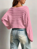 Detail of the flared cuff on a cropped bell sleeve sweater