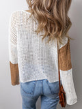 Back view of a woman in a white and brown color block knit hoodie