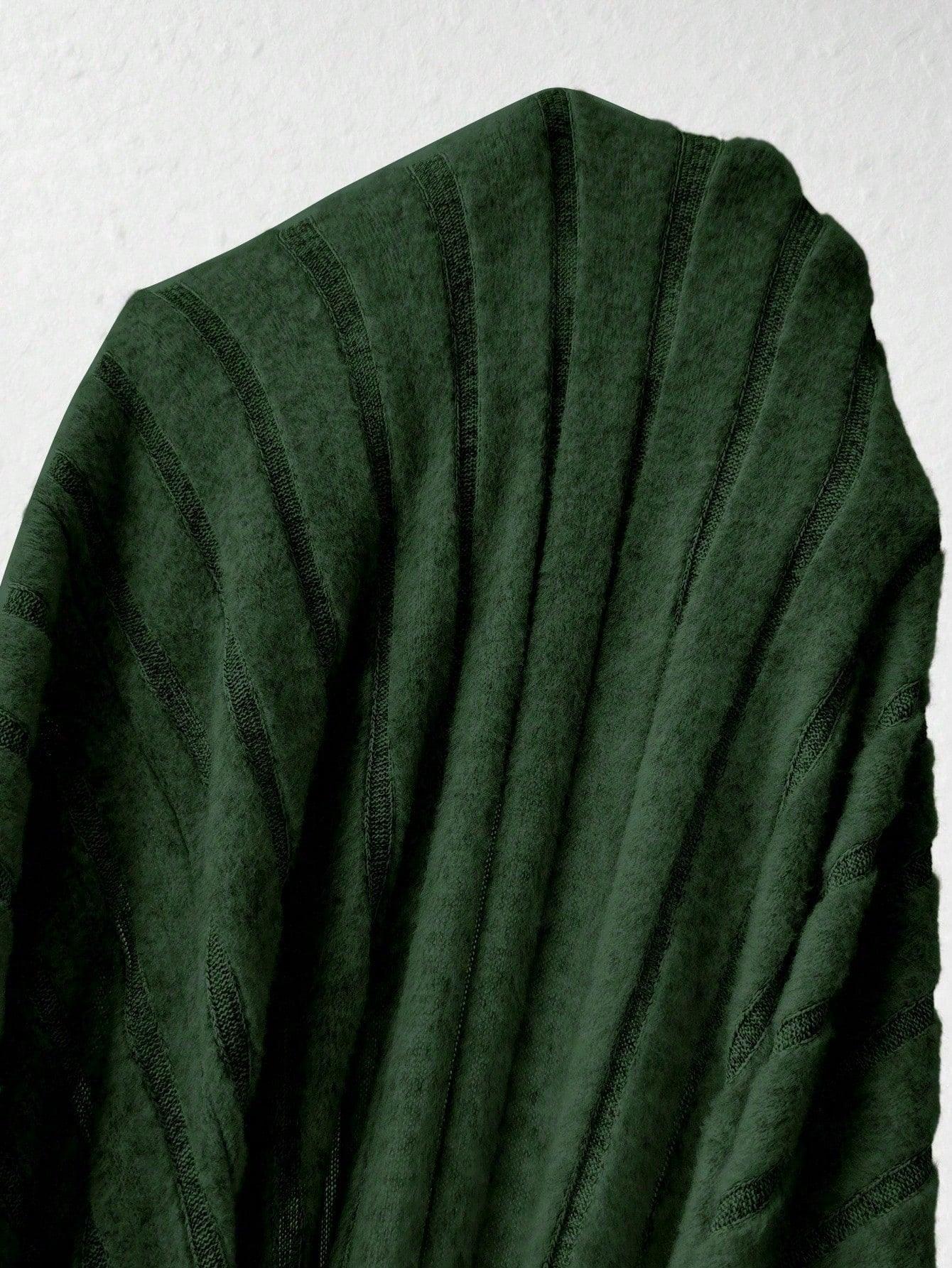 Close-up of dark green ribbed knit fabric