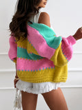 Back view of a woman wearing a vibrant striped knit cardigan