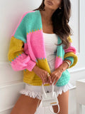 Front view of a woman in a colorful striped knit cardigan