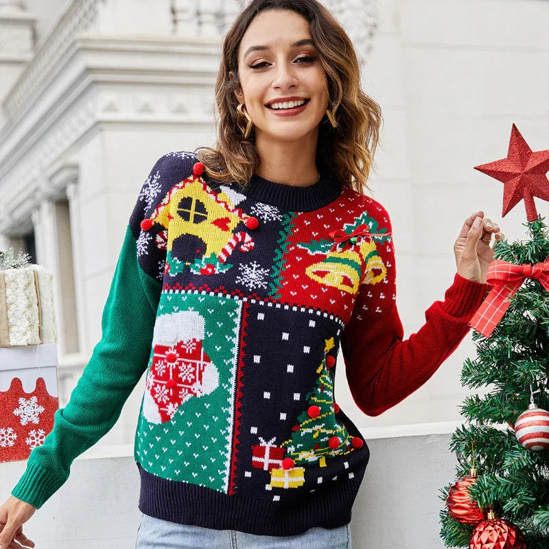 Woman wearing a festive patchwork holiday knit sweater with a gingerbread house design.