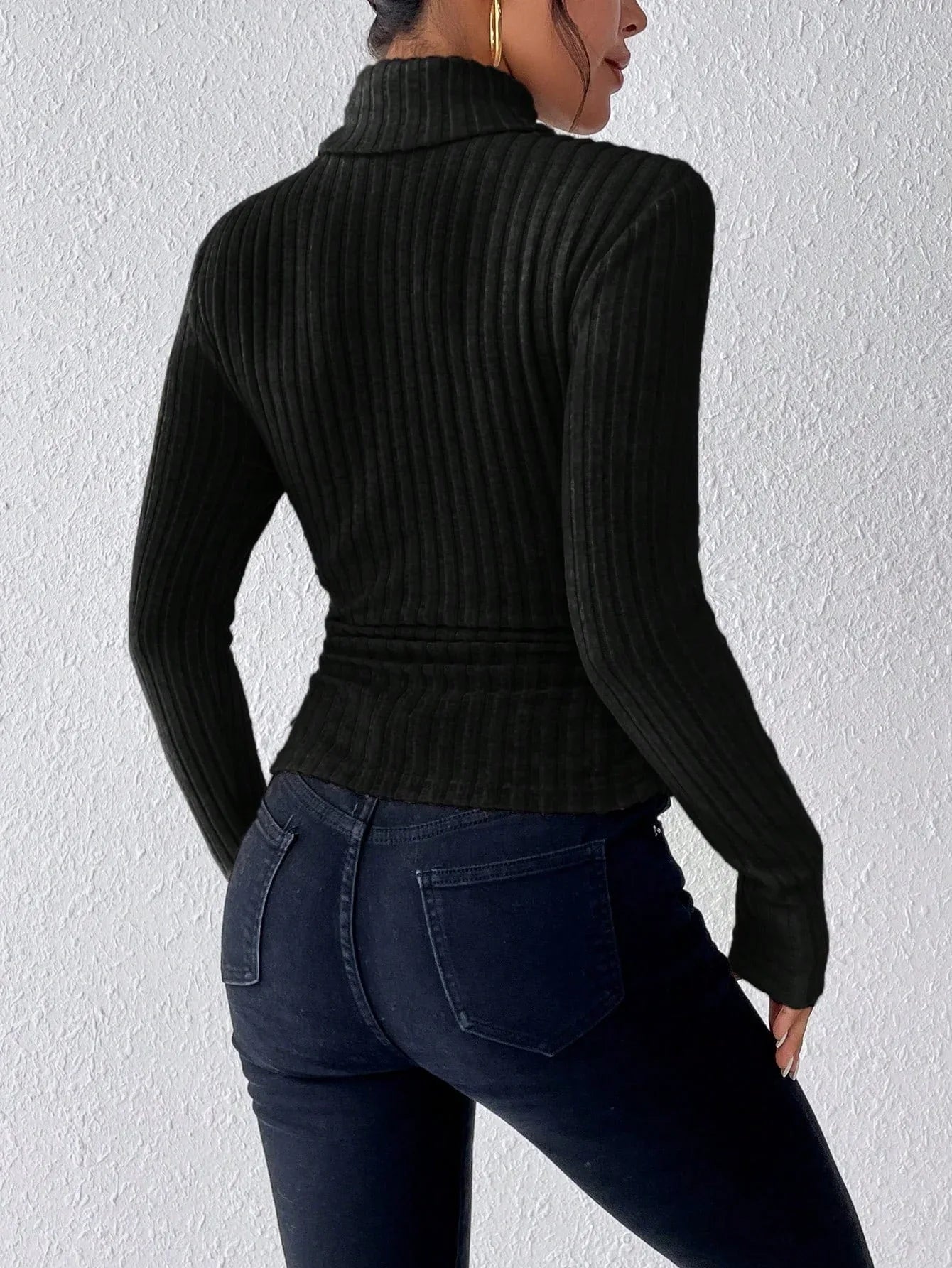 Back view of a black fitted turtleneck shirt